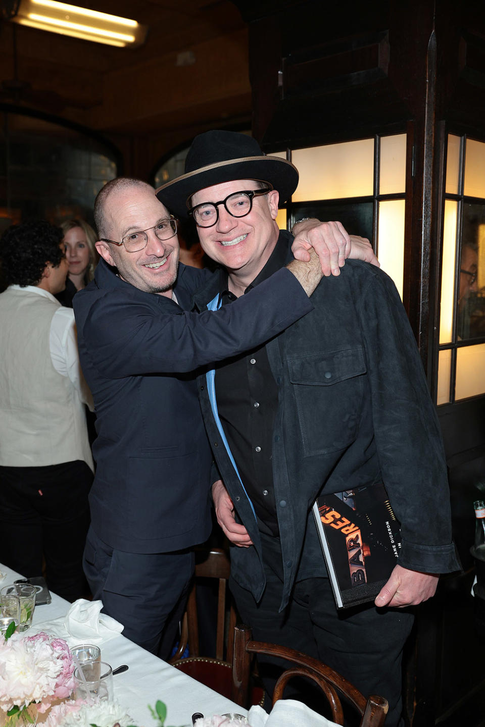 (L-R) Darren Aronofsky and Brendan Fraser attend CHANEL Tribeca Festival Artists Dinner at Balthazar on June 12, 2023 in New York City.