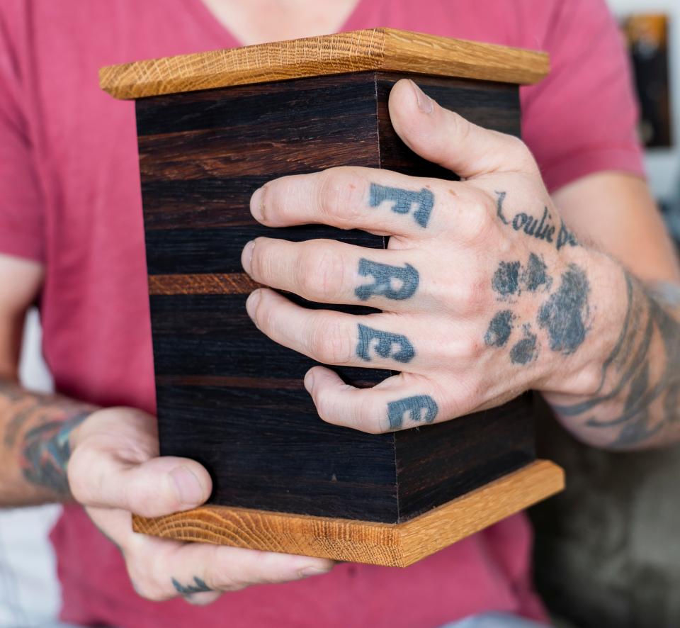 Barry Hoffman holds his father's urn.