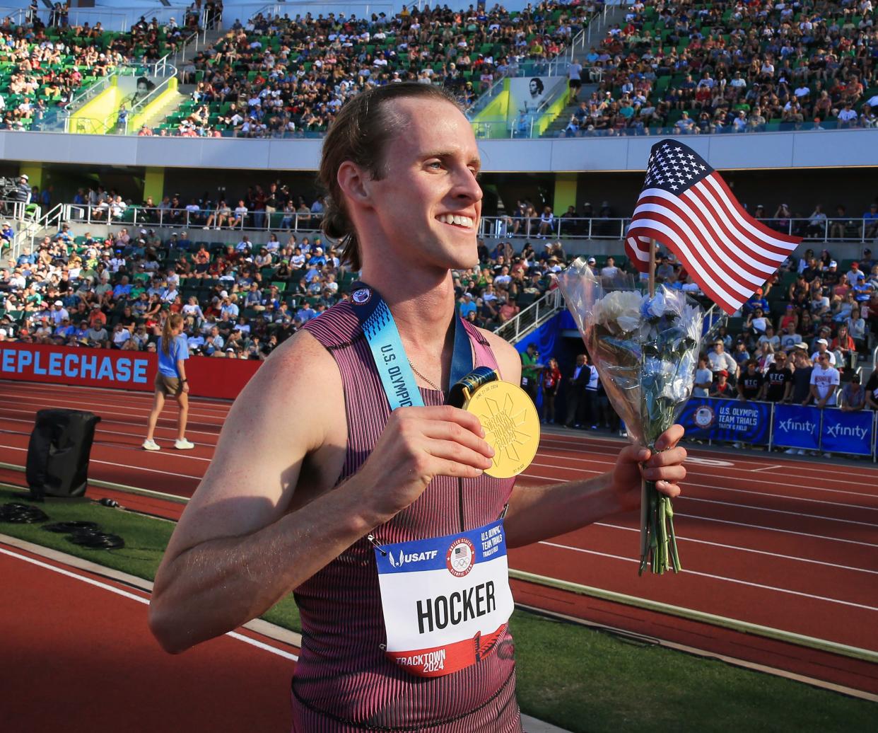 Cole Hocker shows off his gold medal after winning the men’s 1,500 meters during day 4 of the U.S. Olympic Trials at Hayward Field in Eugene June 24.