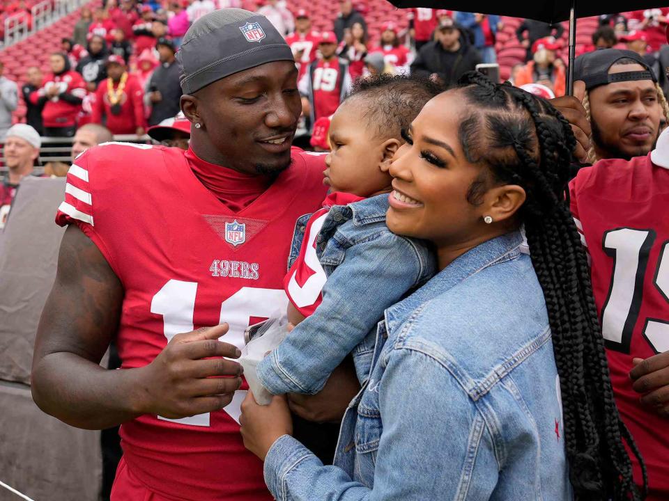 <p>Tony Avelar/AP</p> Deebo Samuel and his girlfriend Mahogany Jones with their son Tyshun Raequan Samuel Jr. before an NFL football game between the 49ers and the Seattle Seahawks on Sept. 18, 2022.