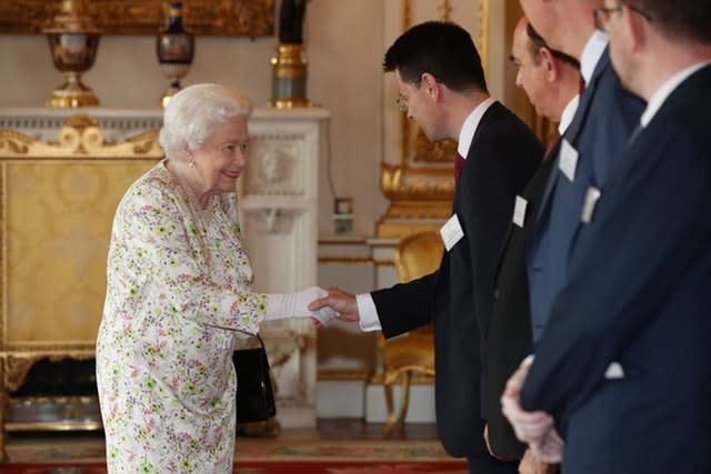Queen Elizabeth II greets Housing Secretary James Brokenshire (Jonathan Brady/PA)