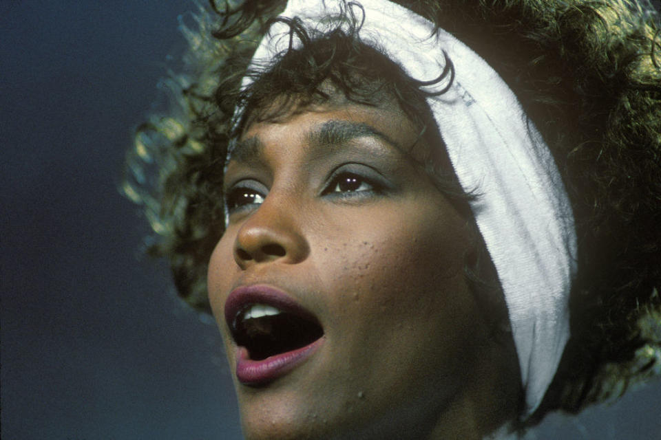 Close-up of Whitney singing