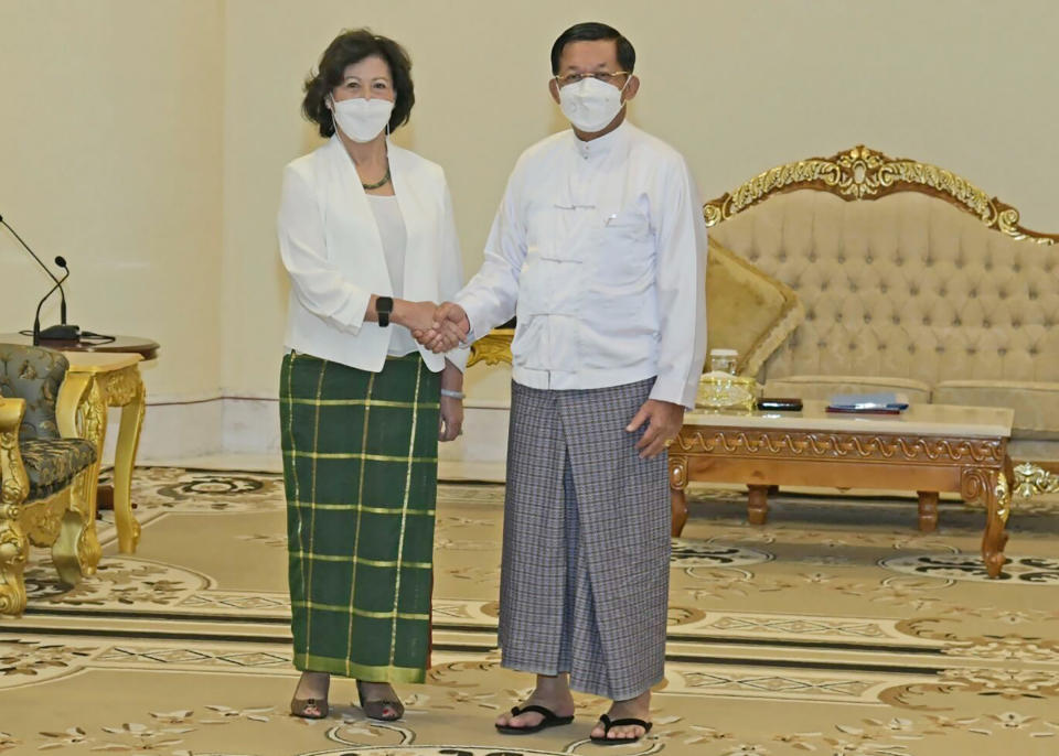 FILE - In this image provided by the Military True News Information Team, United Nations special envoy for Myanmar Noeleen Heyzer, left, and State Administration Council Chairman Senior Gen. Min Aung Hlaing shake hands Wednesday, Aug. 17, 2022, in Naypyitaw, Myanmar. Heyzer warned Tuesday, Oct. 25 that the political, human rights and humanitarian crisis in the military-ruled Southeast Asian nation is deepening and taking “a catastrophic toll on the people.” Her briefing to the U.N. General Assembly’s human rights committee was her first at the U.N. in New York since she visited Myanmar in August and met with Senior Gen. Min Aung Hlaing. (Myanmar True News Information Team via AP, File)