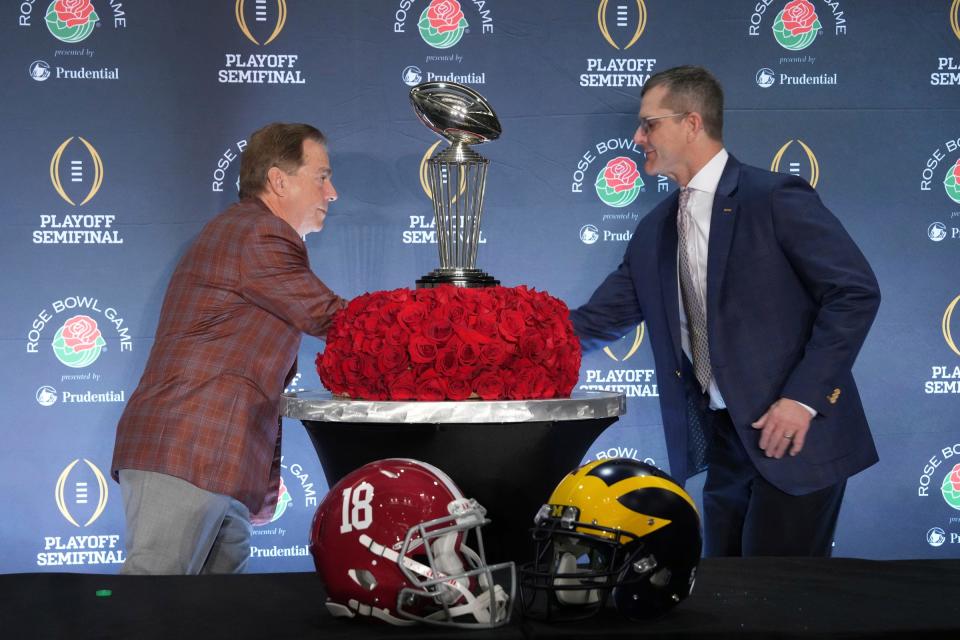 Alabama Crimson Tide head coach Nick Saban (left) and Michigan Wolverines head coach Jim Harbaugh shake hands at the Rose Bowl coaches news conference at the Sheraton Grand Hotel in Los Angeles on Sunday, Dec. 31, 2023.