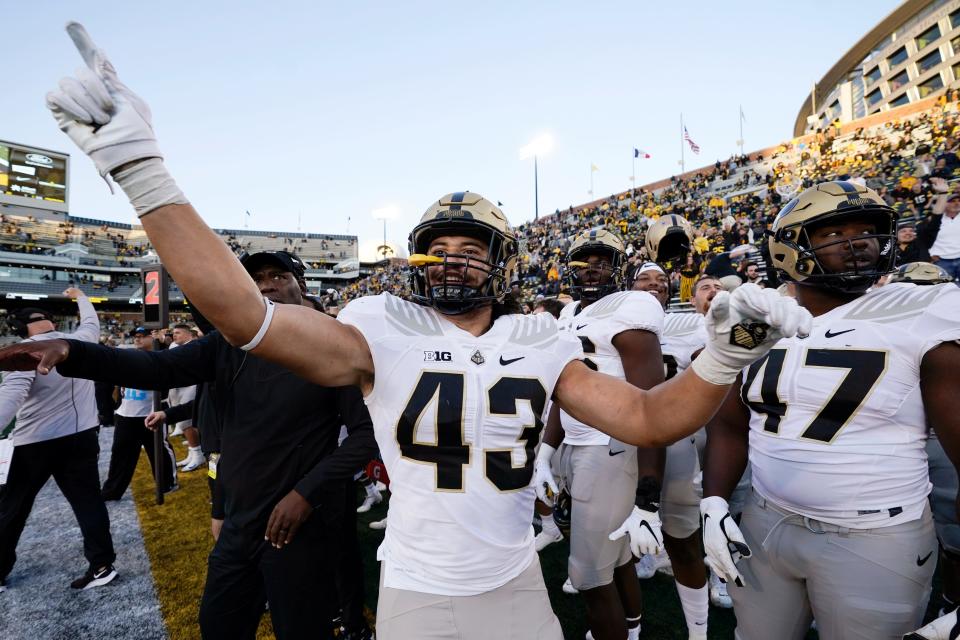 Purdue linebacker Kieren Douglas (43) celebrates at the end of an NCAA college football game against Iowa, Saturday, Oct. 16, 2021, in Iowa City, Iowa. Purdue won 24-7. (AP Photo/Charlie Neibergall)