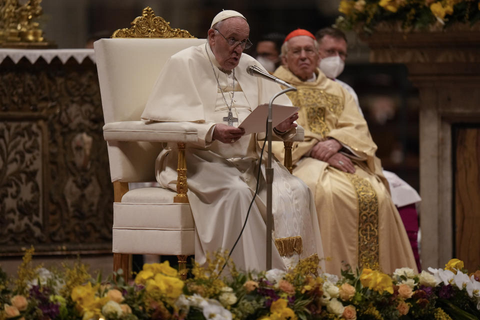 Pope Francis presides over a Easter vigil ceremony in St. Peter's Basilica at the Vatican, Saturday, April 16, 2022. (AP Photo/Alessandra Tarantino)