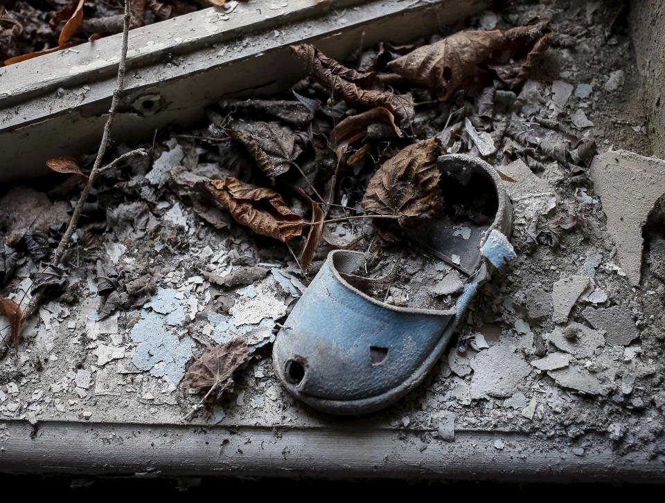 A shoe for children is left in a kindergarten in the abandoned city of Pripyat near the Chernobyl nuclear power plant in Ukraine March 28, 2016.  REUTERS/Gleb Garanich