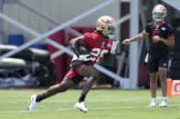 San Francisco 49ers rookie quarterback Trey Lance, right, and running back Trey Sermon, left, run drills during NFL football rookie minicamp in Santa Clara, Calif., Friday, May 14, 2021. (AP Photo/Tony Avelar)