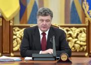 This handout picture taken and released by the Ukrainian presidential press-service on January 25, 2015 shows President Petro Poroshenko speaking during an emergency meeting of the National Security and Defence Council in Kiev