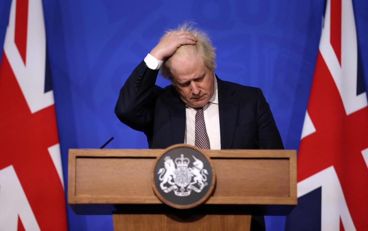 Boris Johnson gestures as he attends a media briefing on the latest Covid-19 update in the Downing Street briefing room