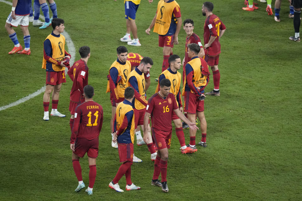 Spain players react after the World Cup group E soccer match between Japan and Spain, at the Khalifa International Stadium in Doha, Qatar, Thursday, Dec. 1, 2022. Japan won 2-1 and qualified to the round of sixteen. (AP Photo/Themba Hadebe) (AP Photo/Themba Hadebe)