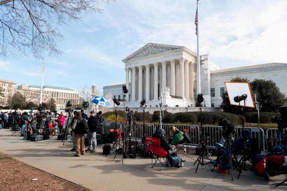 PHOTO: Members of the press are set up outside the US Supreme Court in Washington, DC, on Feb. 8, 2024.  (Roberto Schmidt/AFP via Getty Images)