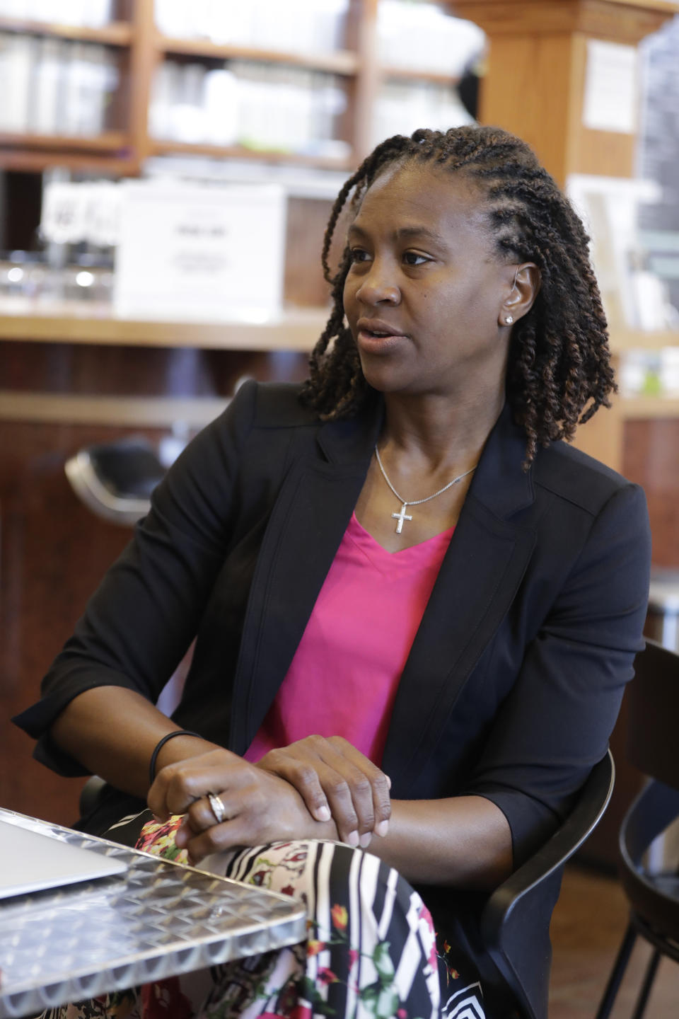 Tamika Catchings meets with Rod Haywood at Tea's Me Cafe, Wednesday, June 26, 2019, in Indianapolis. Nearly three years since Catchings played her final basketball game, the 39-year-old former star is establishing herself in a variety of new roles: Business owner and front-office executive, not to mention being a contestant on NBC’s popular “American Ninja Warrior.” (AP Photo/Darron Cummings)