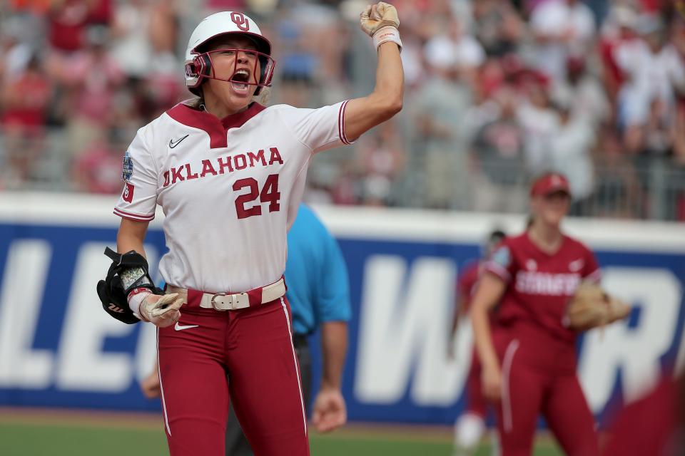 Oklahoma's Jayda Coleman (24) celebrates after getting a hit and driving in a run in the fifth inning of a softball game between University of Oklahoma Sooners (OU) and Stanford in the Women's College World Series at USA Softball Hall of Fame Stadium in Oklahoma City, Thursday, June 1, 2023. Oklahoma won 2-0.