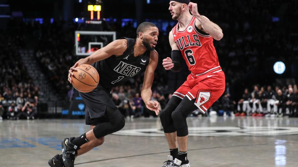 Mar 29, 2024; Brooklyn, New York, USA; Brooklyn Nets forward Mikal Bridges (1) looks to drive past Chicago Bulls guard Alex Caruso (6) in the first quarter at Barclays Center.