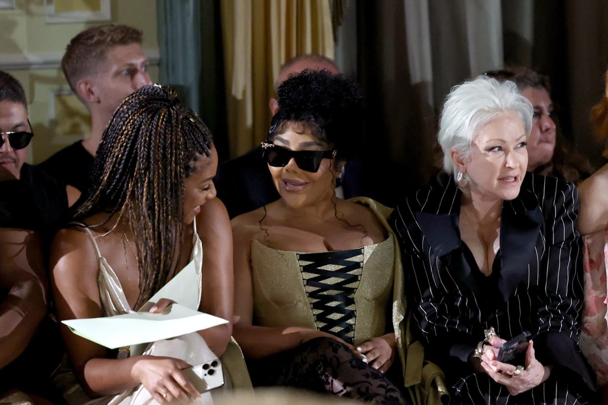 From left: Tiffany Haddish, Lil Kim and Cyndi Lauper attend the Christian Siriano spring/summer 2025 runway show at The Pierre Hotel on Sept. 6, 2024, in New York City.