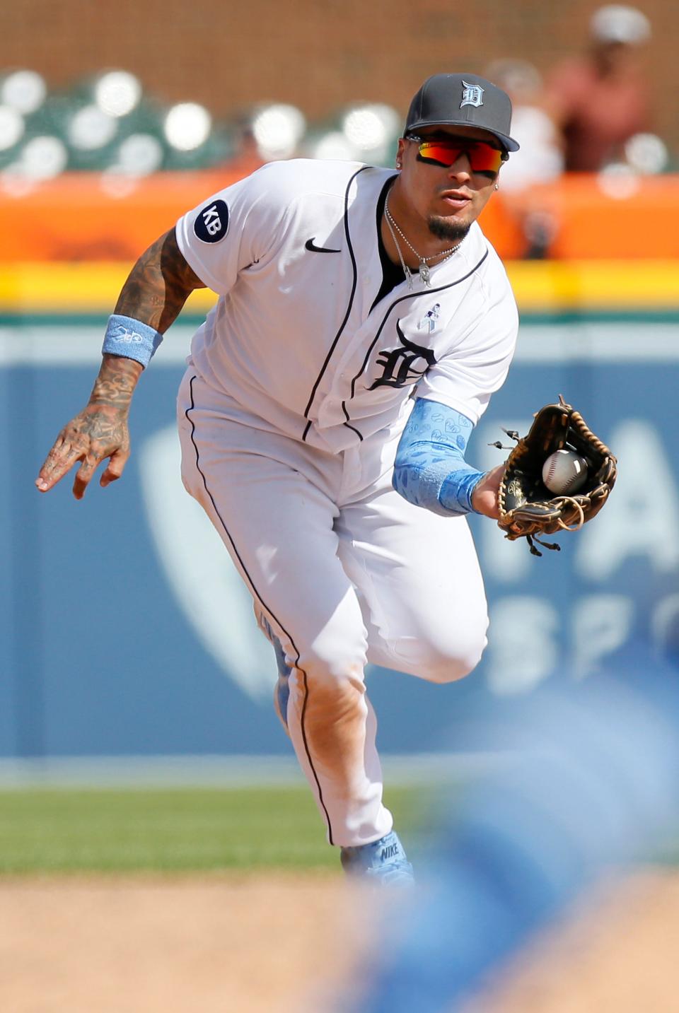 Shortstop Javier Baez (28) of the Detroit Tigers fields a grounder hit by Ezequiel Duran of the Texas Rangers for an out during the ninth inning at Comerica Park on June 19, 2022, in Detroit, Michigan.