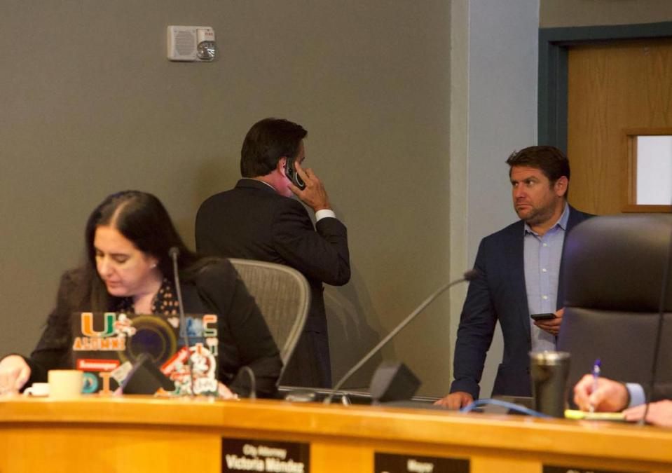 Miami Commissioner Alex Díaz de la Portilla is seen on the phone during a City Commission meeting at City Hall in Miami, Florida, on Thursday, Sept. 14, 2023. He was later arrested on a host of corruption charges that include bribery and money laundering, according to the Florida Department of Law Enforcement.