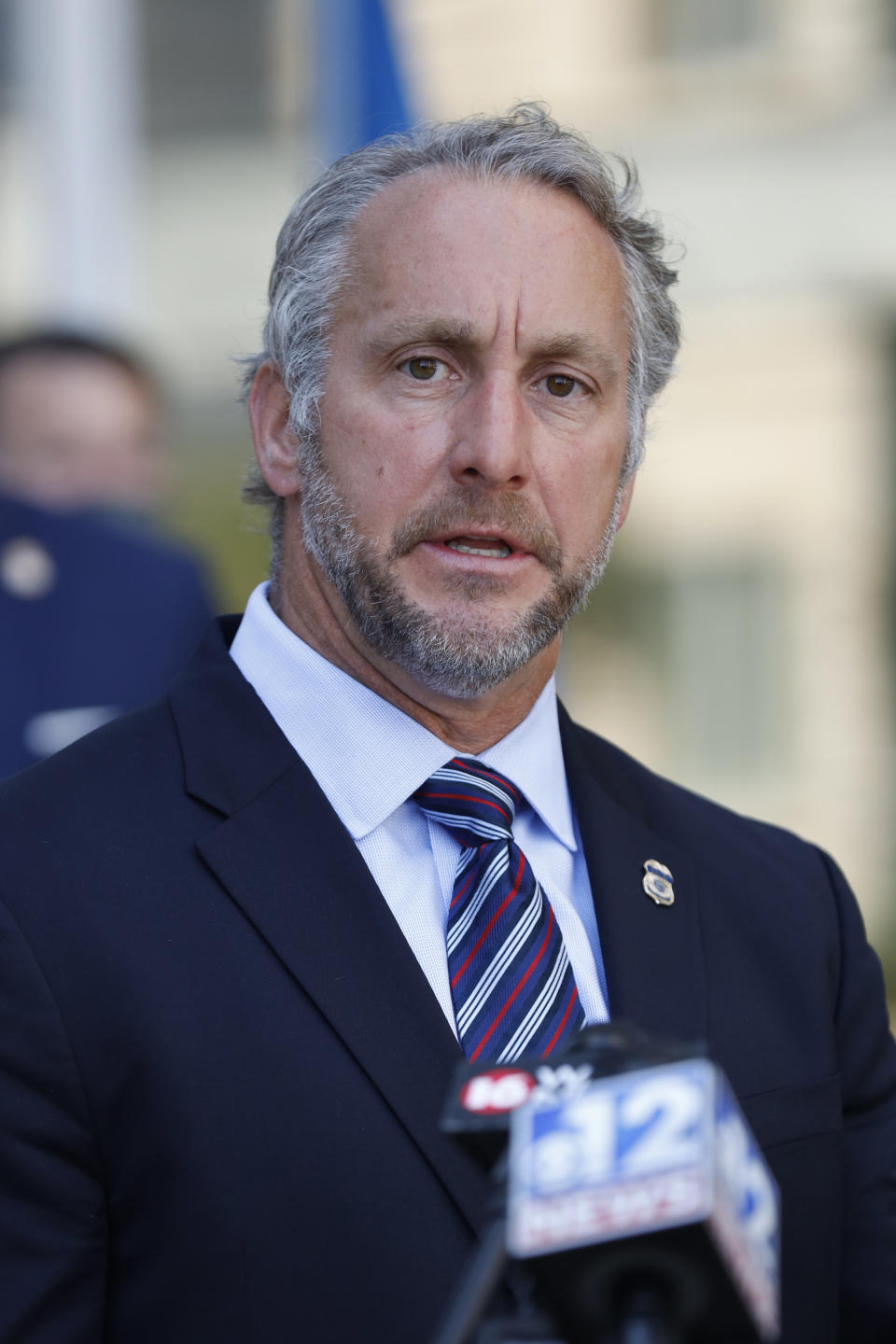 Acting Director of U.S. Immigration and Customs Enforcement Matt Albence comments Thursday, Aug. 6, 2020, in Jackson, Miss., after the announcement of the indictments of four executives from two Mississippi poultry processing plants on federal charges tied to one of the largest workplace immigration raids in the U.S. in the past decade. Their announcement happened a day before the one-year anniversary of the raids in which 680 people were arrested at seven poultry plants in central Mississippi. (AP Photo/Rogelio V. Solis)