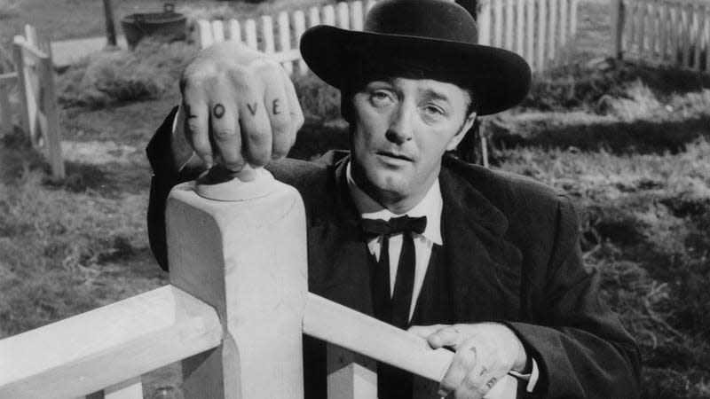 Robert Mitchum with his fresh ink<br>