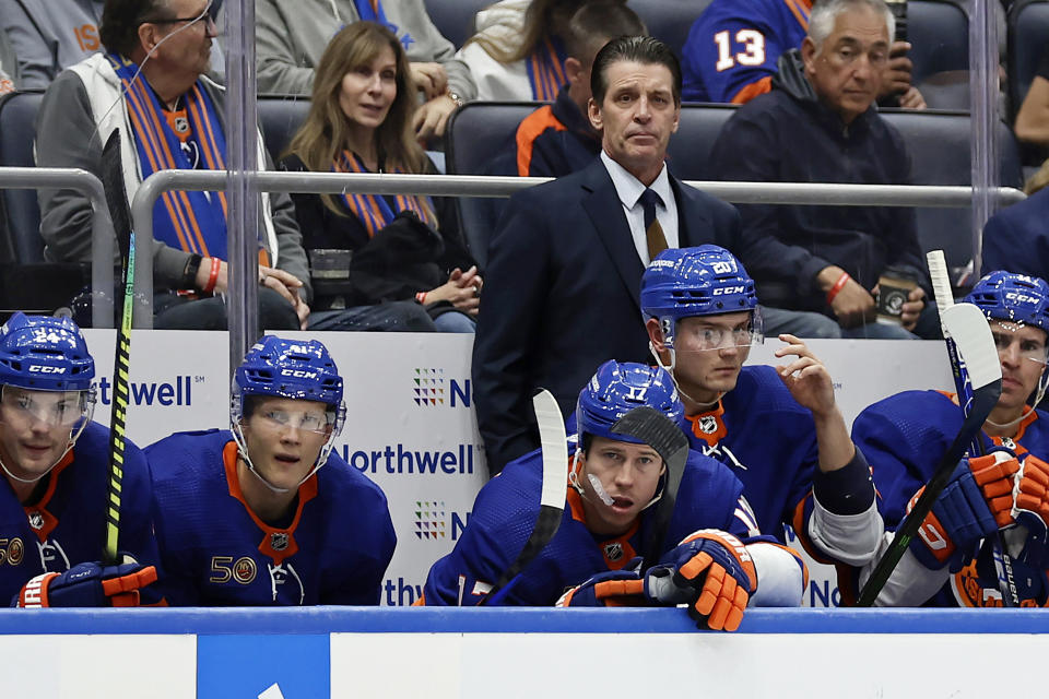 New York Islanders coach Lane Lambert watches the team play against the Florida Panthers during the third period of an NHL hockey game Thursday, Oct. 13, 2022, in Elmont, N.Y. The Panthers won 3-1. (AP Photo/Adam Hunger)