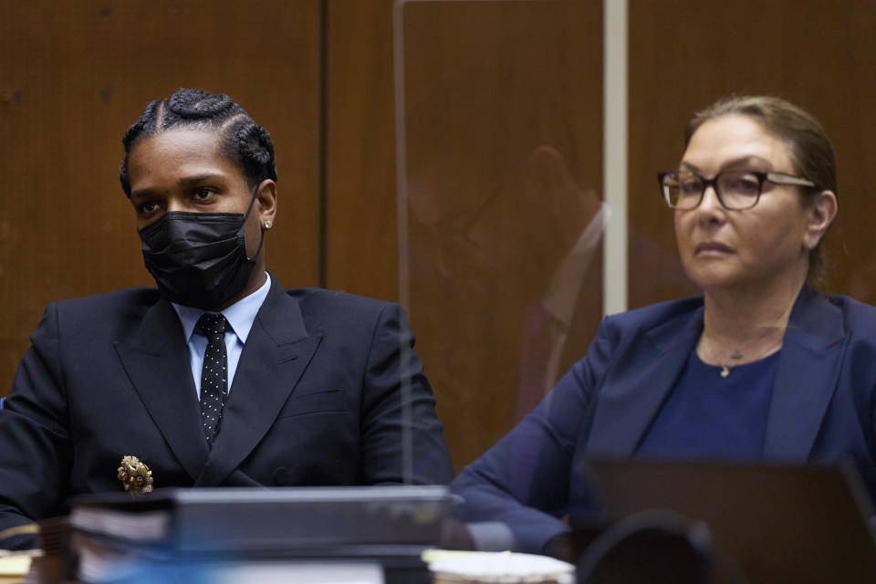 Rakim Mayers, aka A$AP Rocky, sits with a member of his legal team in the Clara Shortridge Foltz Criminal Justice Center for a preliminary hearing in his assault with a semiautomatic firearm case in Los Angeles on Monday, Nov. 20, 2023. The charges stem from a November 2021 incident where Rocky allegedly pointed a semi-automatic handgun at Terell Ephron and fired multiple times. (Allison Dinner/EPA via AP, Pool)