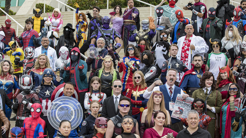 A large group of Marvel cosplayers pose for a group photo on Day 3 of Comic-Con International 2023