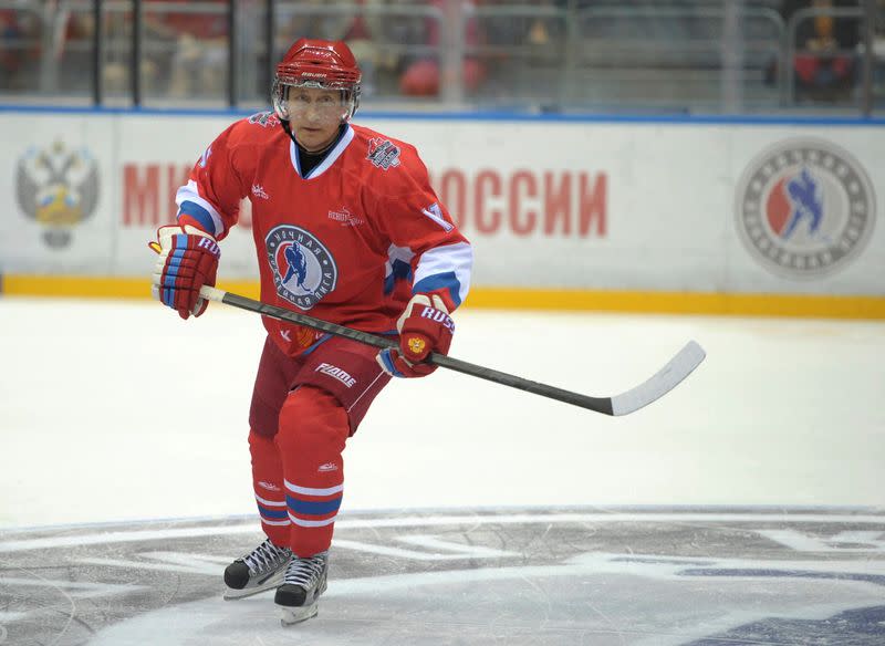 FILE PHOTO: Russian President Putin takes part in an invitational ice hockey match in Sochi