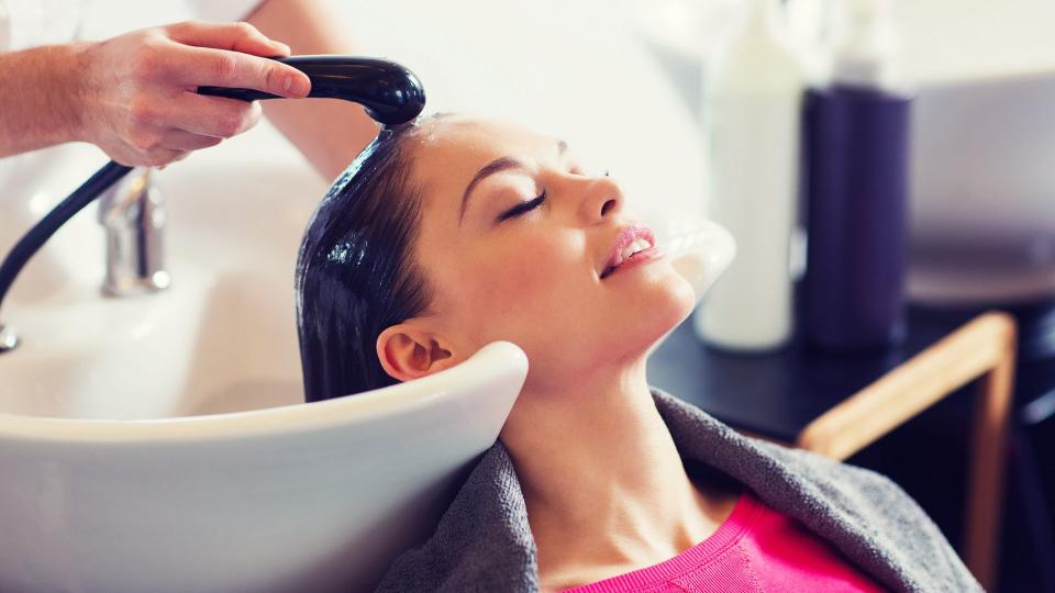 washing hair at salon.