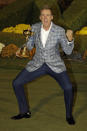 FILE - Europe's Ian Poulter celebrates with the trophy after winning the Ryder Cup PGA golf tournament at the Medinah Country Club in Medinah, Ill., in this Sept. 30, 2012, file photo. Poulter is 14-6-2 in his previous six Ryder Cups. He is 5-0-1 in singles. He has been on five winning teams and only one loser. (AP Photo/Chris Carlson, File)