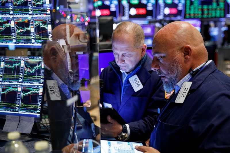 Traders work on the floor of the NYSE in New York