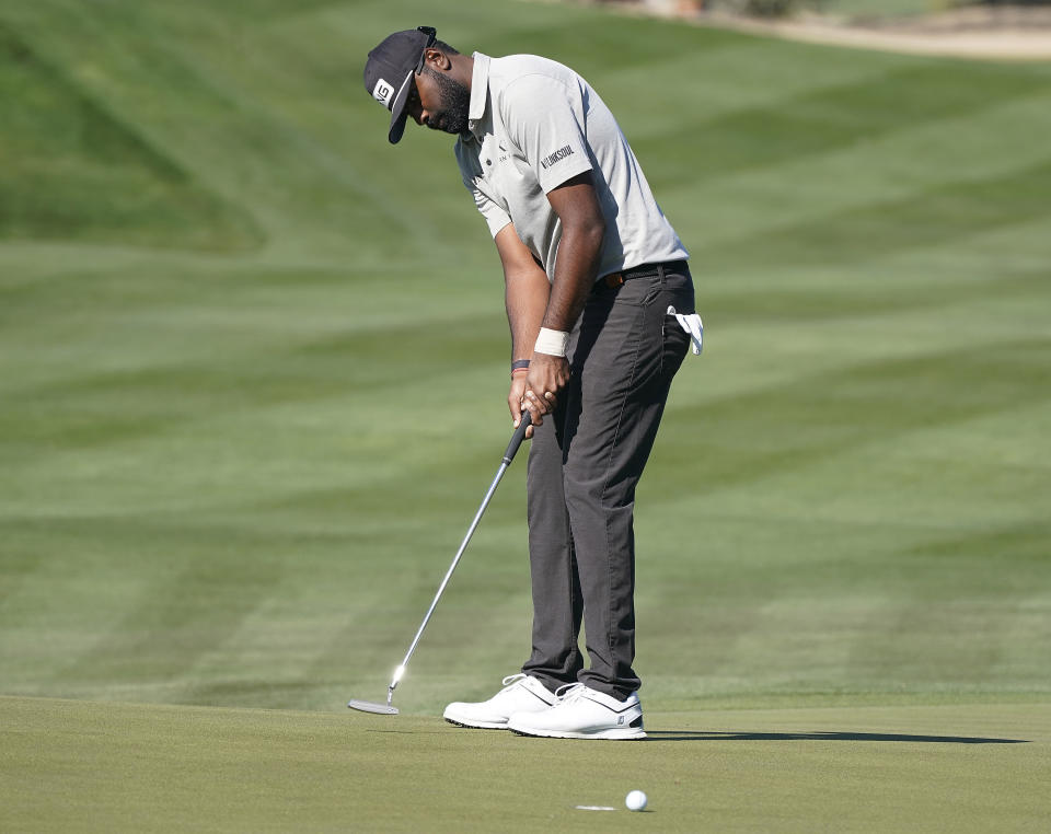 Sahith Theegala watches his putt on the eighth hole during the Phoenix Open golf tournament Friday, Feb. 11, 2022, in Scottsdale, Ariz. (AP Photo/Darryl Webb)