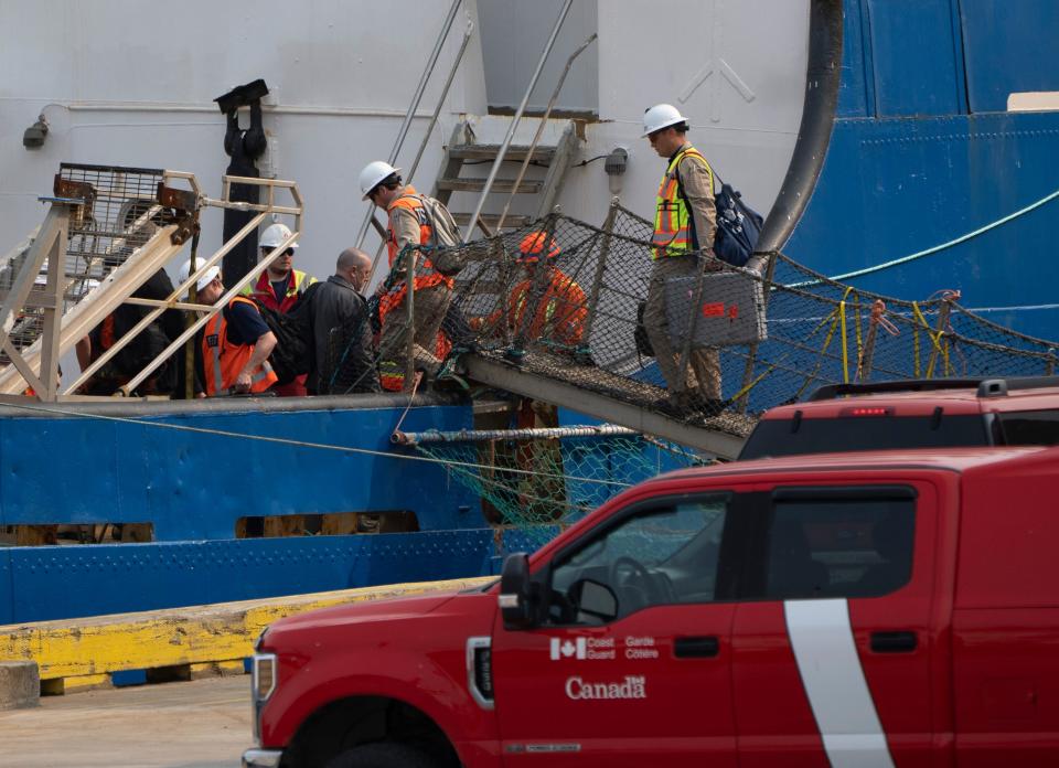 Transportation Safety Board members investigating the Titan, board the Polar Prince after it docked on Saturday, June 24, 2023 in St. John's, Newfoundland. The Titan submersible imploded near the wreckage of the Titanic, killing all five people on board, the U.S. Coast Guard announced Thursday, June 22, 2023.