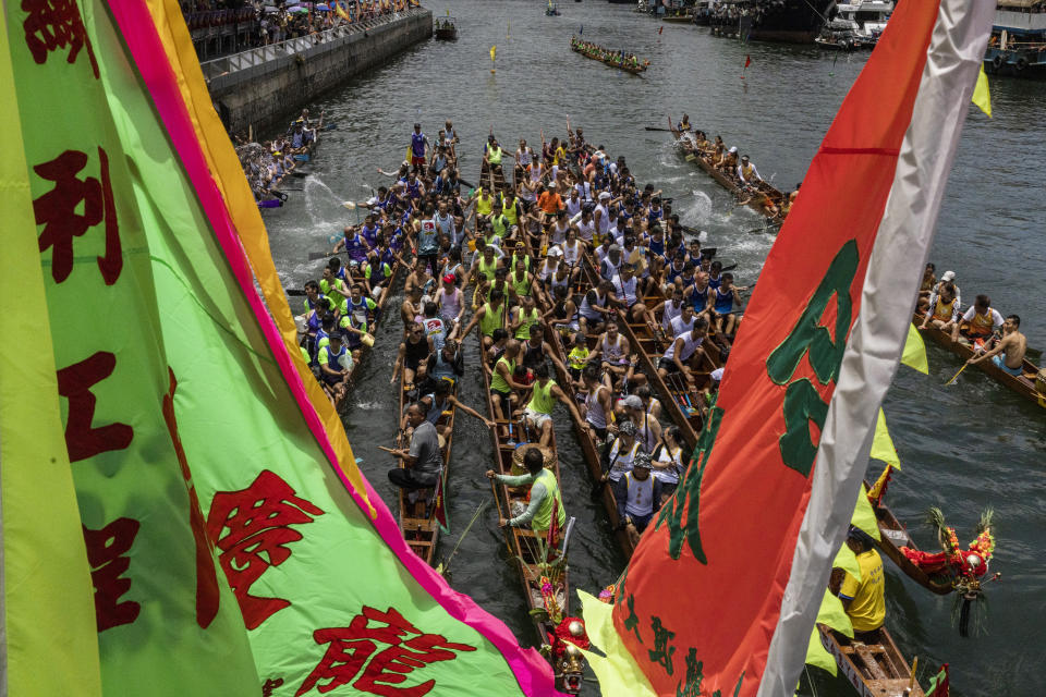 Competitors take part in the annual dragon boat race to celebrate the Tuen Ng festival in Hong Kong, Thursday, June 22, 2023. (AP Photo/Louise Delmotte)