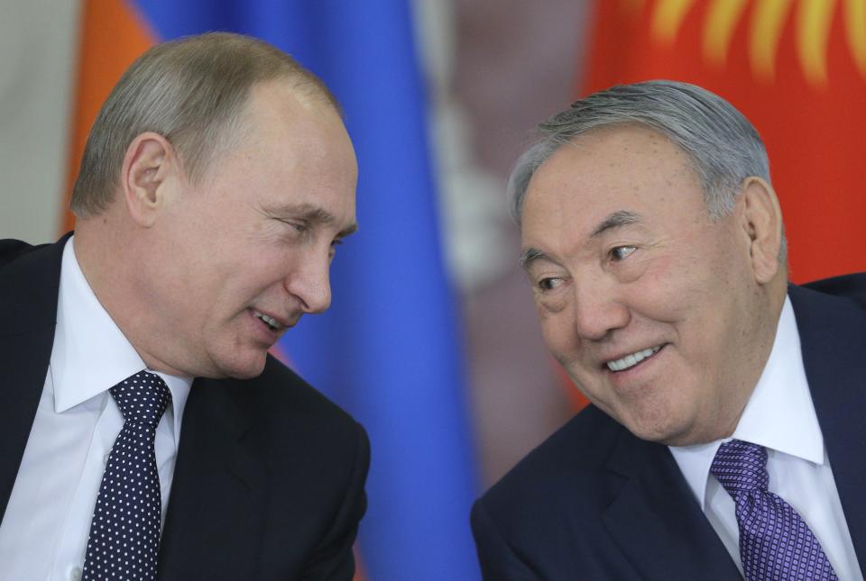 Russian President Vladimir Putin speaks with Kazakh President Nursultan Nazarbayev (R) at a Eurasian Economic Council meeting at the Kremlin in Moscow, December 23, 2014. / Credit: MAXIM SHIPENKOV/AFP/Getty