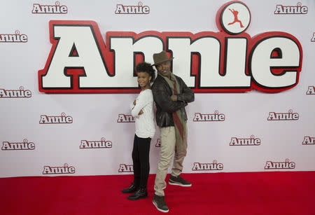 Actor Jamie Foxx, and actress Quvenzhane Wallis pose for photographers during a photocall for their film Annie, in central London December 16, 2014. REUTERS/Neil Hall