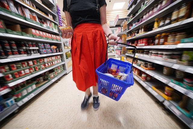 A shopper walking through the aisle of a Tesco supermarket in London. Picture date: Saturday September 3, 2022.
