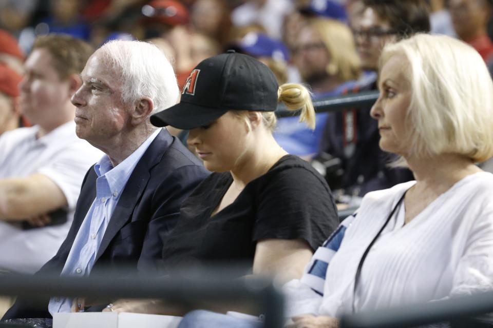 Sen. John McCain watches a Diamondbacks vs. Dodgers game with his daughter Meghan McCain and wife Cindy McCain at Chase Field in Phoenix, Ariz. on August 10, 2017.