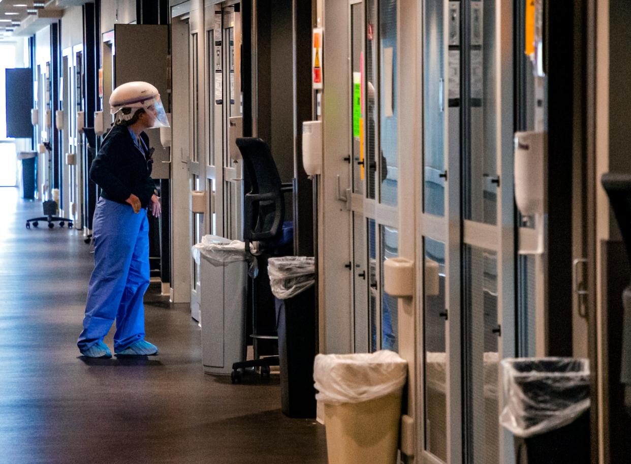 A nurse looks in on a patient's room in 2021 in the COVID-19 ICU at SSM Health St. Anthony Hospital in Oklahoma City.