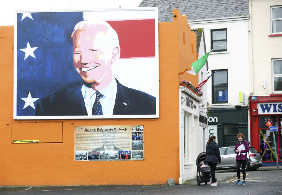 A mural of US Presidential candidate Joe Biden on a gable wall in Ballina, west of Ireland, Wednesday, Nov. 4, 2020. Ballina is the ancestral home of US Presidential candidate Joe Biden. President Donald Trump and his Democratic challenger, Joe Biden, are in a tight battle for the White House. (AP Photo/Peter Morrison)