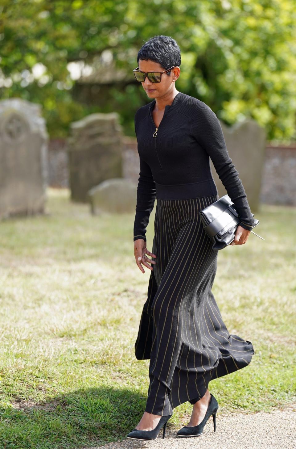 BBC presenter Naga Munchetty arrives for the funeral of TV presenter and journalist Bill Turnbull at Holy Trinity Church in Blythburgh, Suffolk. Picture date: Friday September 16, 2022. PA Photo. The former BBC Breakfast presenter died at his home in Suffolk on September 1 following a prostate cancer fight, which had been diagnosed in November 2017. See PA story FUNERAL Turnbull. Photo credit should read: Joe Giddens/PA Wire