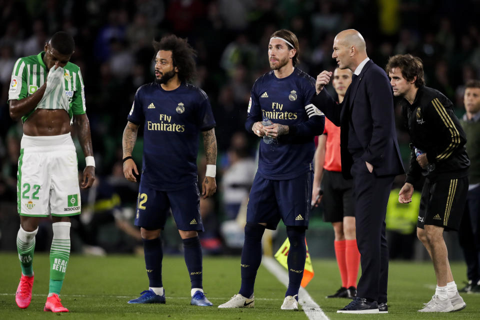 SEVILLA, SPAIN - MARCH 8: (L-R) Emerson of Real Betis, Marcelo of Real Madrid, Sergio Ramos of Real Madrid, coach Zinedine Zidane of Real Madrid during the La Liga Santander  match between Real Betis Sevilla v Real Madrid at the Estadio Benito Villamarin on March 8, 2020 in Sevilla Spain (Photo by David S. Bustamante/Soccrates/Getty Images)