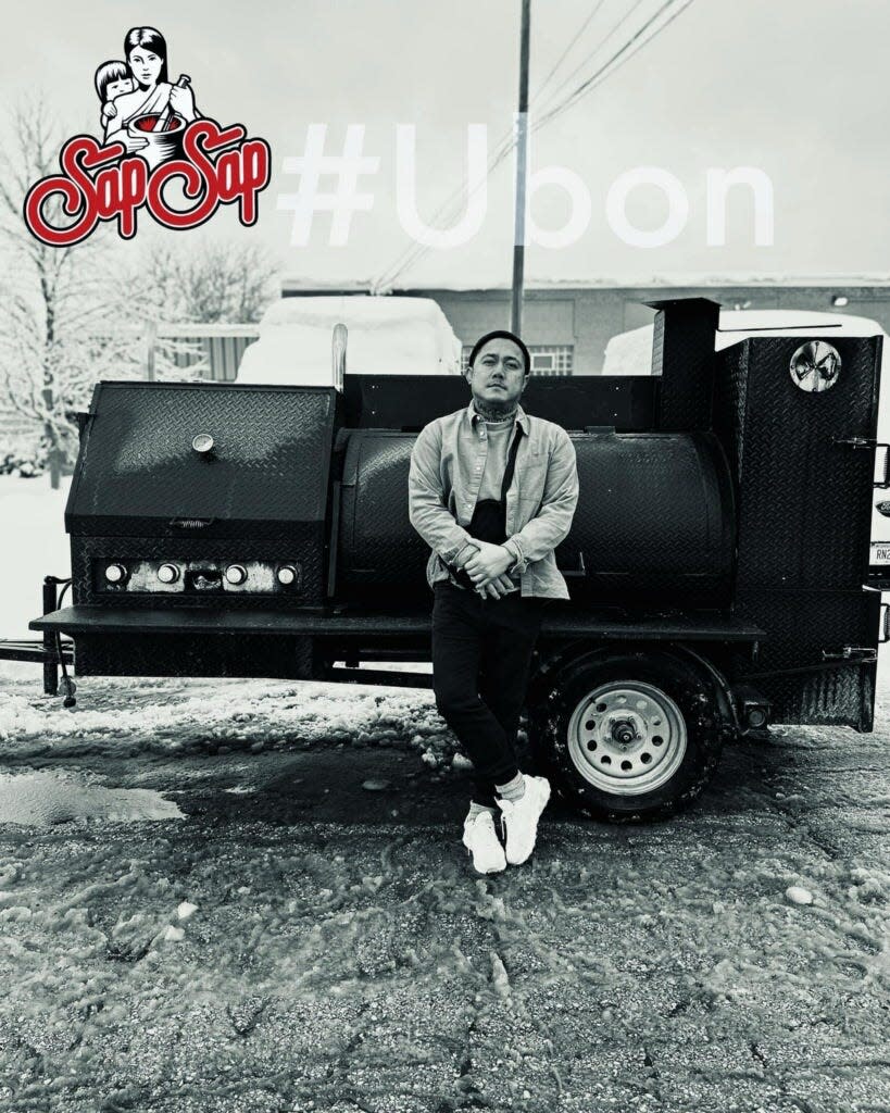 In this promotional photo, Alex Hanesakda stands in front of his smoker, named Ubon after the refugee camp where his family once lived.