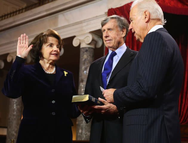 Chip Somodevilla/Getty Sen. Dianne Feinstein takes the oath of office with then-Vice President Joe Biden and her husband, Richard Blum