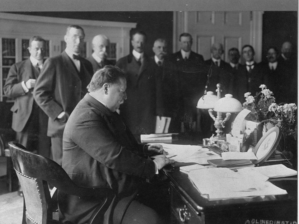 President Taft sits in the Oval Office.