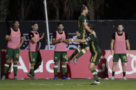 Portland Timbers midfielder Sebastian Blanco, top, celebrates his goal with Diego Valeri against the Philadelphia Union during the second half of an MLS soccer match, Wednesday, Aug. 5, 2020, in Kissimmee, Fla. (AP Photo/John Raoux)