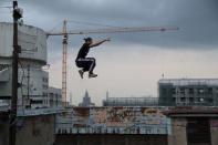 Vad Him of Rudex team jumps whilst on a rooftop in Moscow, Russia, August 14, 2017. REUTERS/Maxim Shemetov