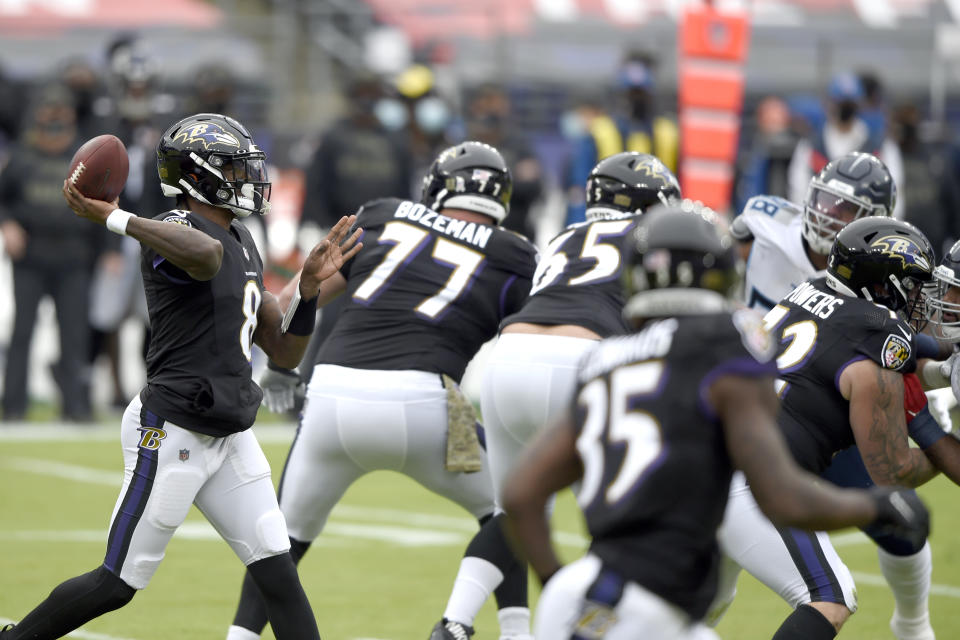 Baltimore Ravens quarterback Lamar Jackson throws a pass against the Tennessee Titans during the first half of an NFL football game, Sunday, Nov. 22, 2020, in Baltimore. (AP Photo/Gail Burton)