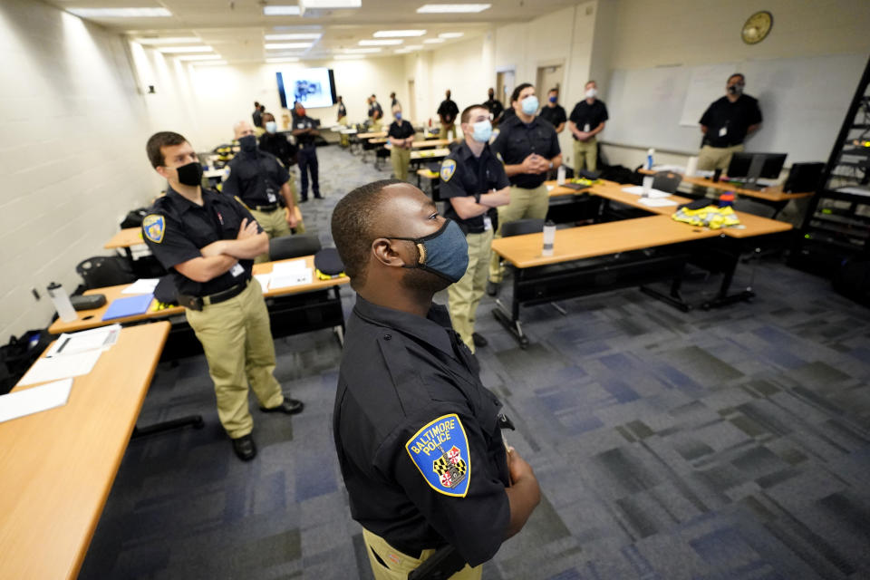 In this Sept. 9, 2020, photo Baltimore Police Academy cadets watch a video presentation during a class session focusing on procedural justice in Baltimore. (AP Photo/Julio Cortez)