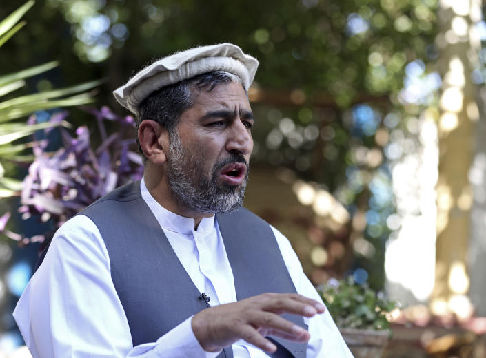 In this Thursday, May 30, 2019 photo, Ajmal Omar a member of the Nangarhar provincial council speaks during an interview with The Associated Press in the city of Jalalabad, Afghanistan. The Islamic State group has lost its caliphate in Syria and Iraq, but in the forbidding mountains of northeastern Afghanistan the group is expanding its footprint, recruiting new fighters and plotting attacks in the United States and other Western countries. Omar said IS now has a presence in the provinces of Nangarhar, Nuristan, Kunar and Laghman. (AP Photo/Rahmat Gul)